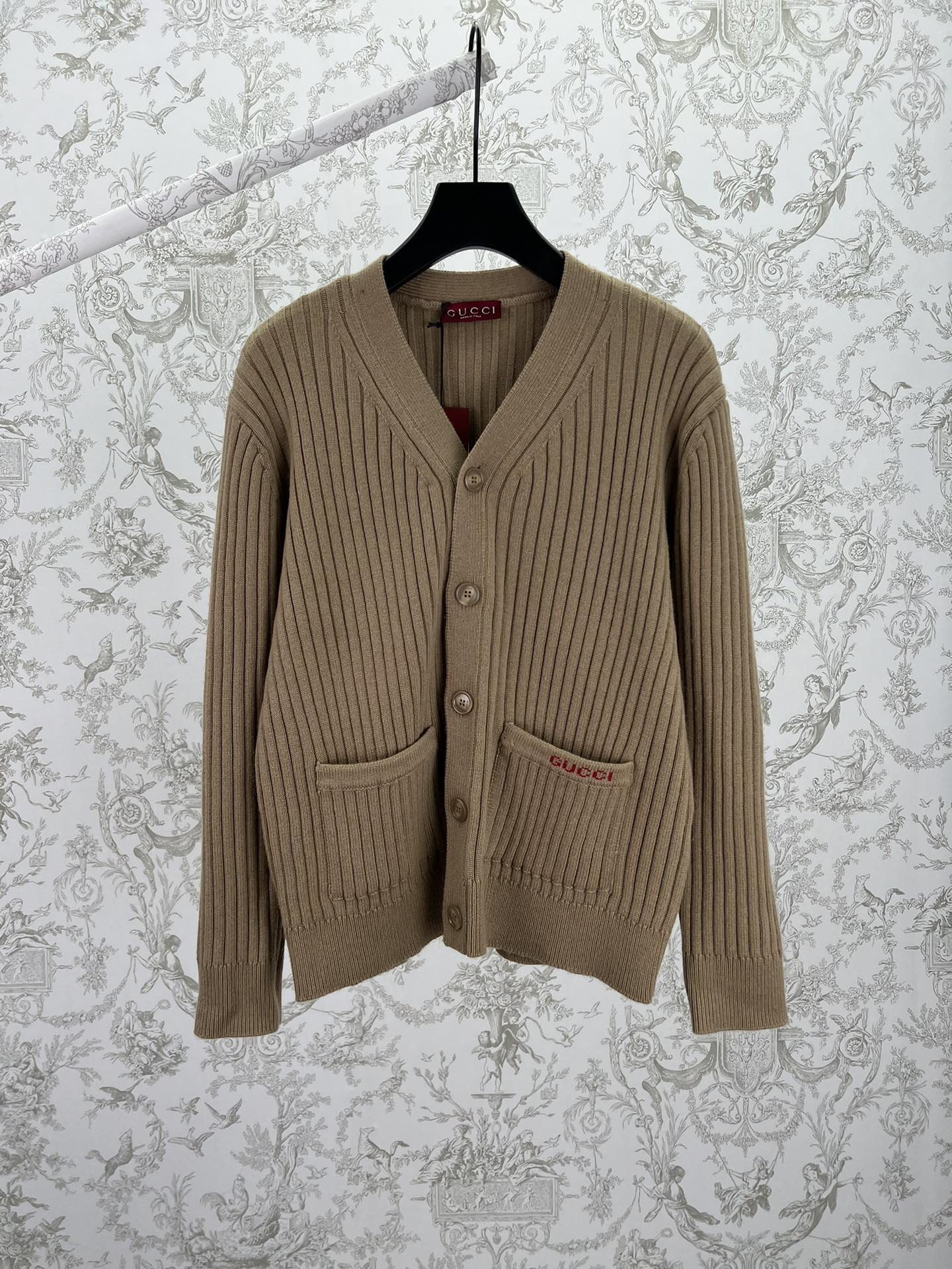 Beige rib-knit V-neck cardigan sweater with front button placket and pockets