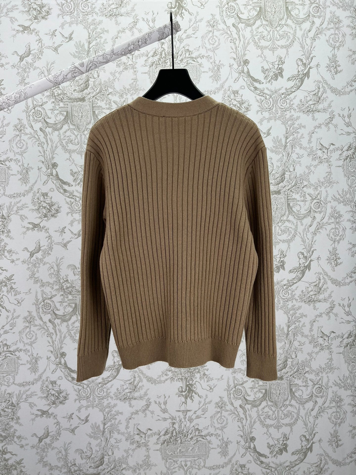 Beige rib-knit cardigan sweater back view with vertical rib pattern