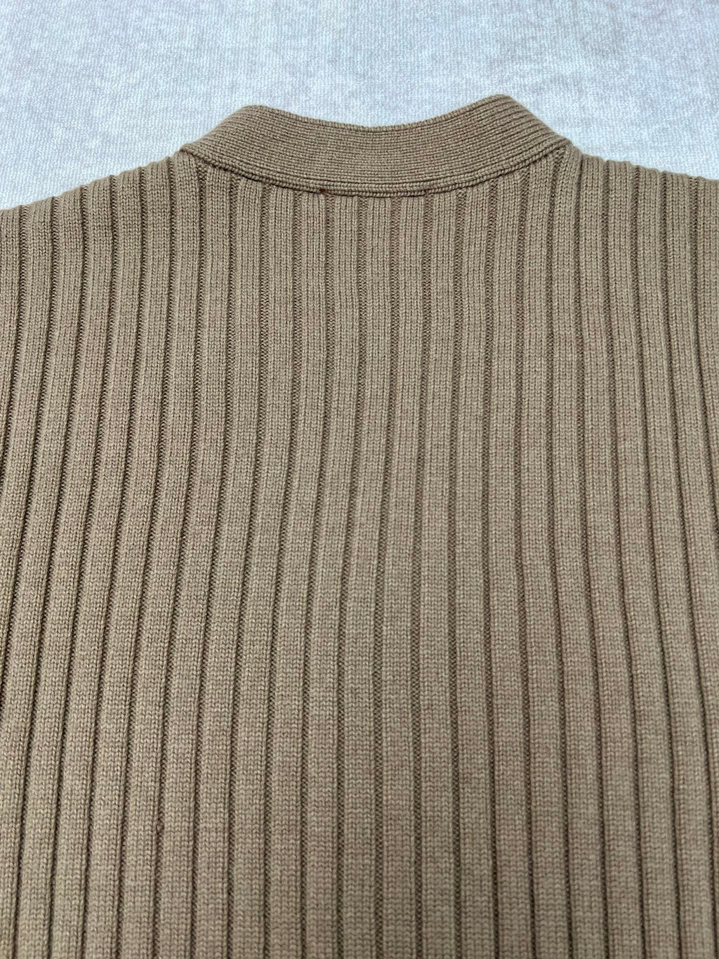 Beige rib-knit cardigan sweater back with vertical ribbed texture
