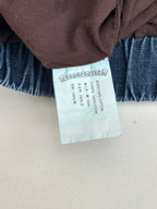 Clothing size tag on blue denim pants waistband