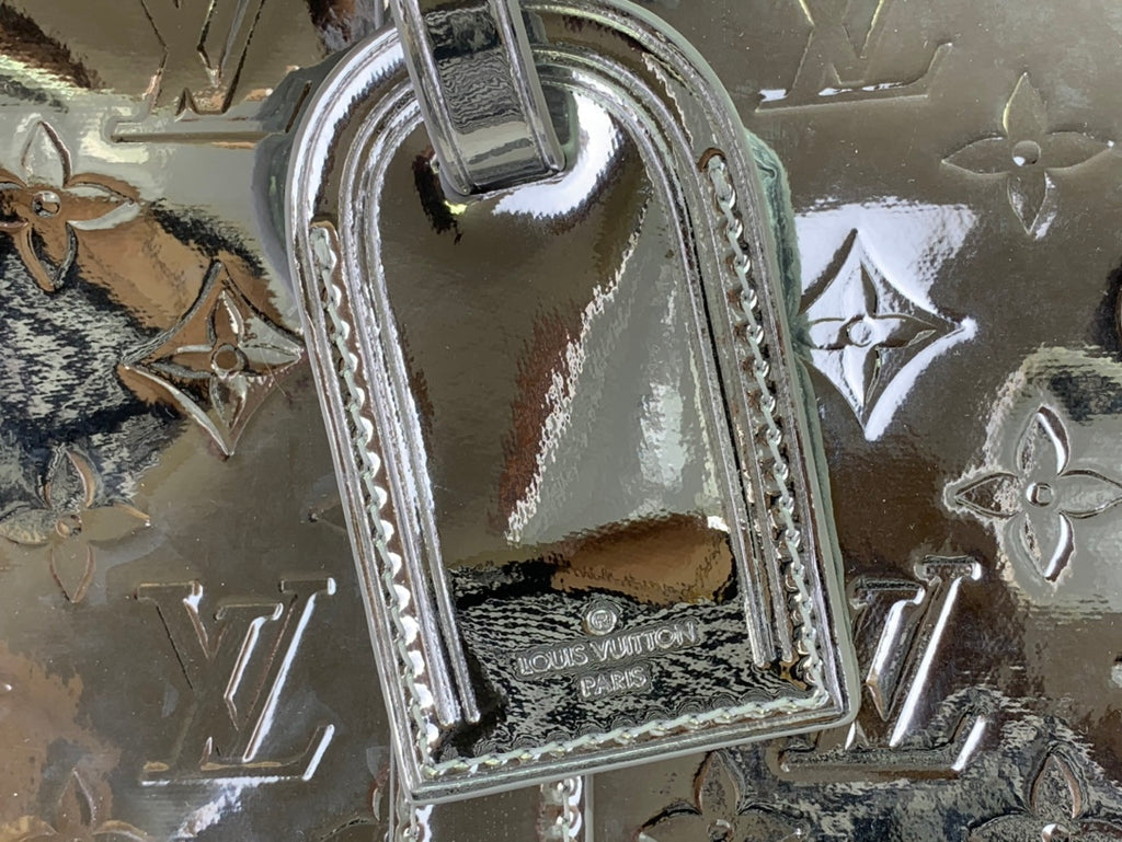 Louis Vuitton metallic silver bag handle hardware with engraved LV letters