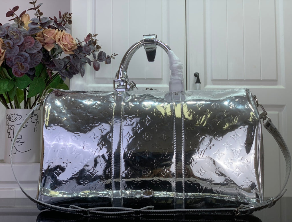 Louis Vuitton metallic silver monogram duffel bag with structured front panels