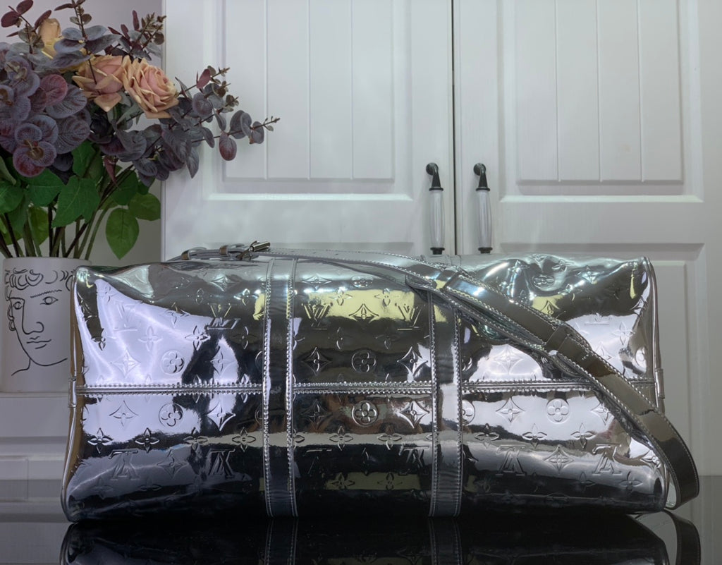 Louis Vuitton metallic silver monogram duffel bag with adjustable shoulder strap