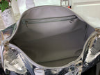 Louis Vuitton metallic silver duffel interior view with zip pocket and fabric lining