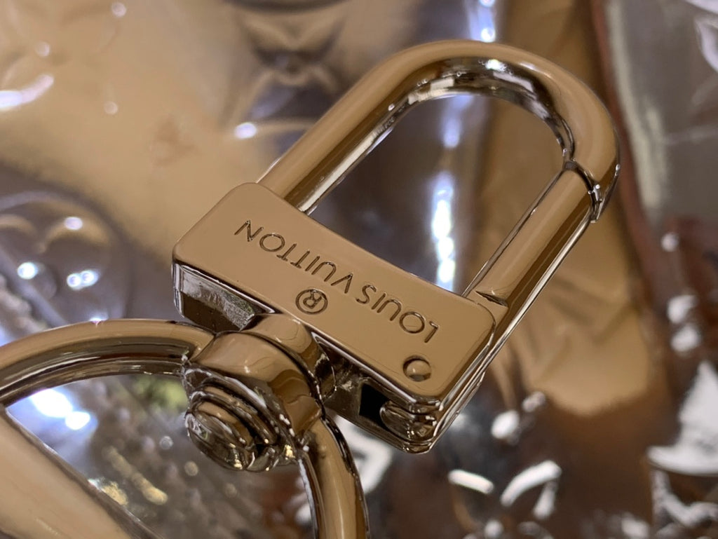 Louis Vuitton metallic silver lock clasp with engraved logo and ring hardware
