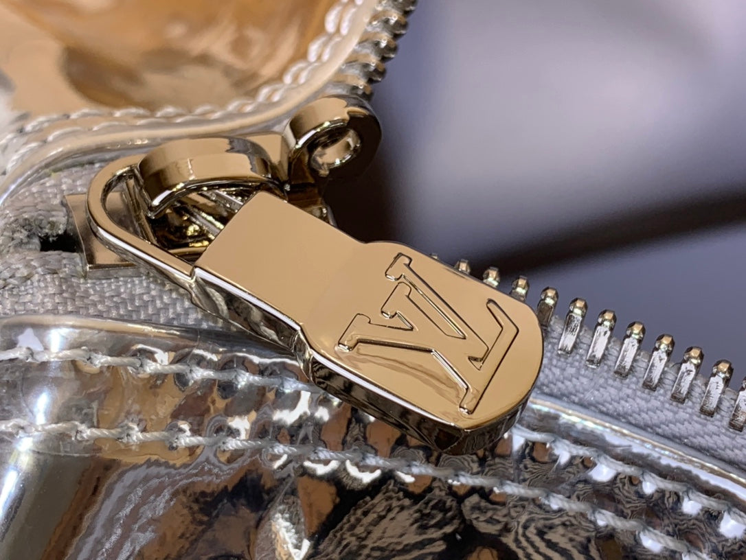 Louis Vuitton metallic silver zipper pull with engraved logo and hardware detail