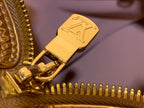 Louis Vuitton monogram zipper pull on coated duffel bag, gold hardware close-up