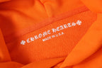 Orange hoodie fabric label text “Made in USA”