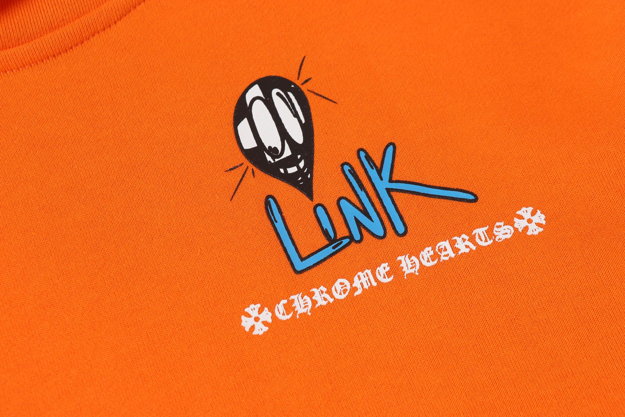 Orange hoodie front with “Link” character logo and white text