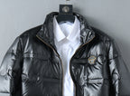 Black puffer jacket with logo patch, stand collar, and zip-front placket