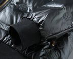 Black puffer jacket sleeve cuff and elastic hem with fabric button detail