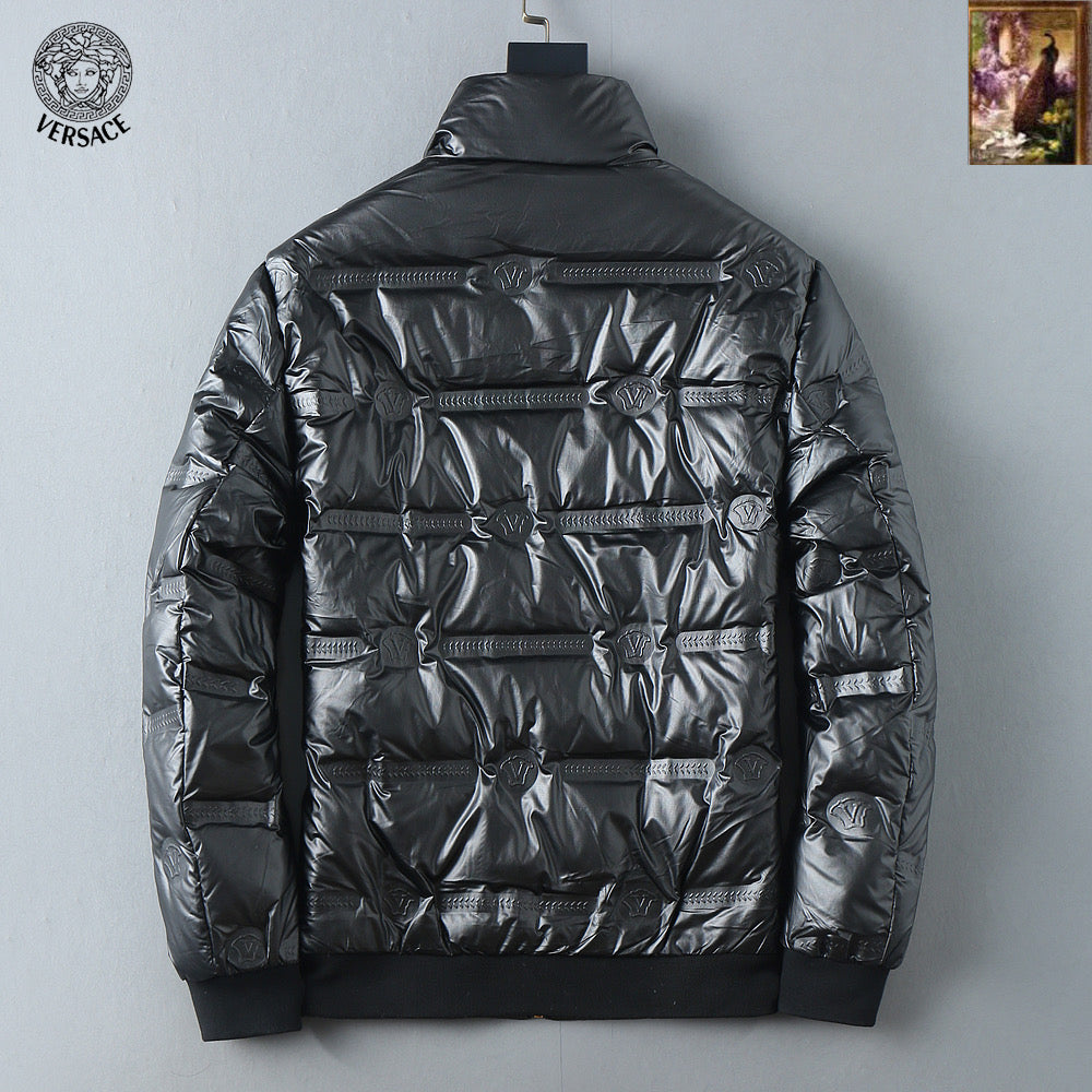 Black puffer jacket back view with high collar and quilted panels