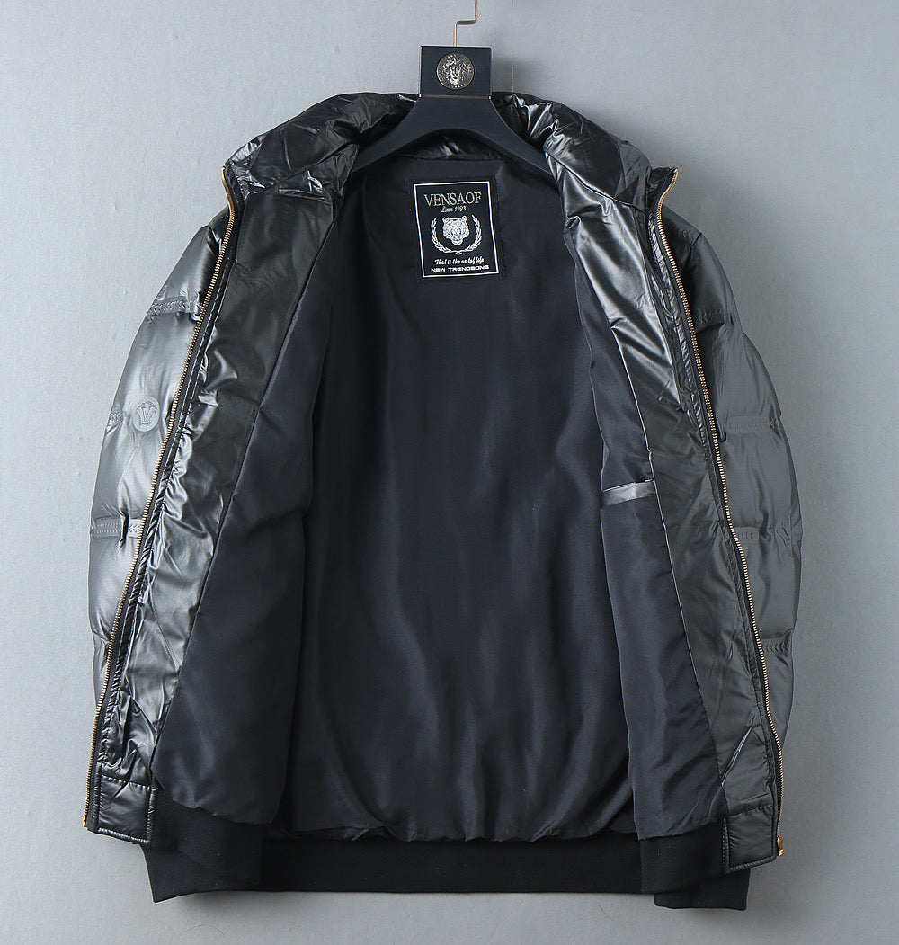 Black puffer jacket with interior label at neckline and open front lining