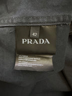 Size 42 fabric care label inside jacket on dark lining with printed text