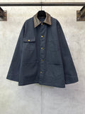 Navy long jacket with point collar, button front, and two flap chest pockets