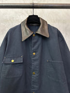 Navy long jacket with beige contrast point collar, button front, and flap chest pockets