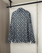 Long-sleeve top back view with dark geometric pattern and standing collar
