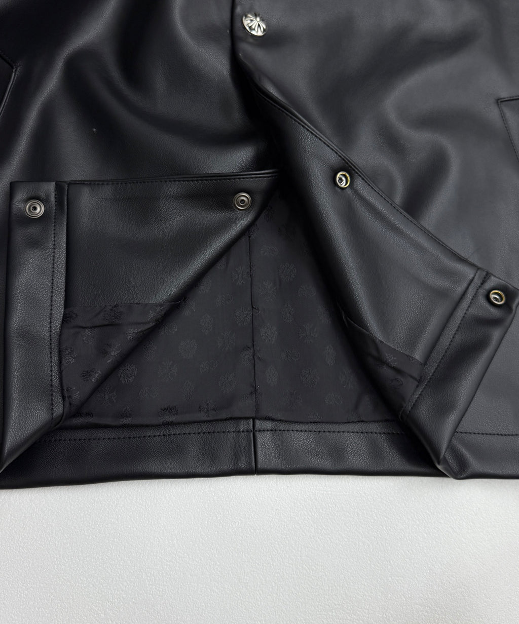 Black leather-look jacket lining with inner flap pockets and snap buttons