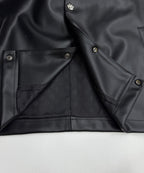 Black leather-look jacket lining with inner flap pockets and snap buttons
