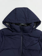 Navy quilted puffer hood with front zipper and dark drawstring