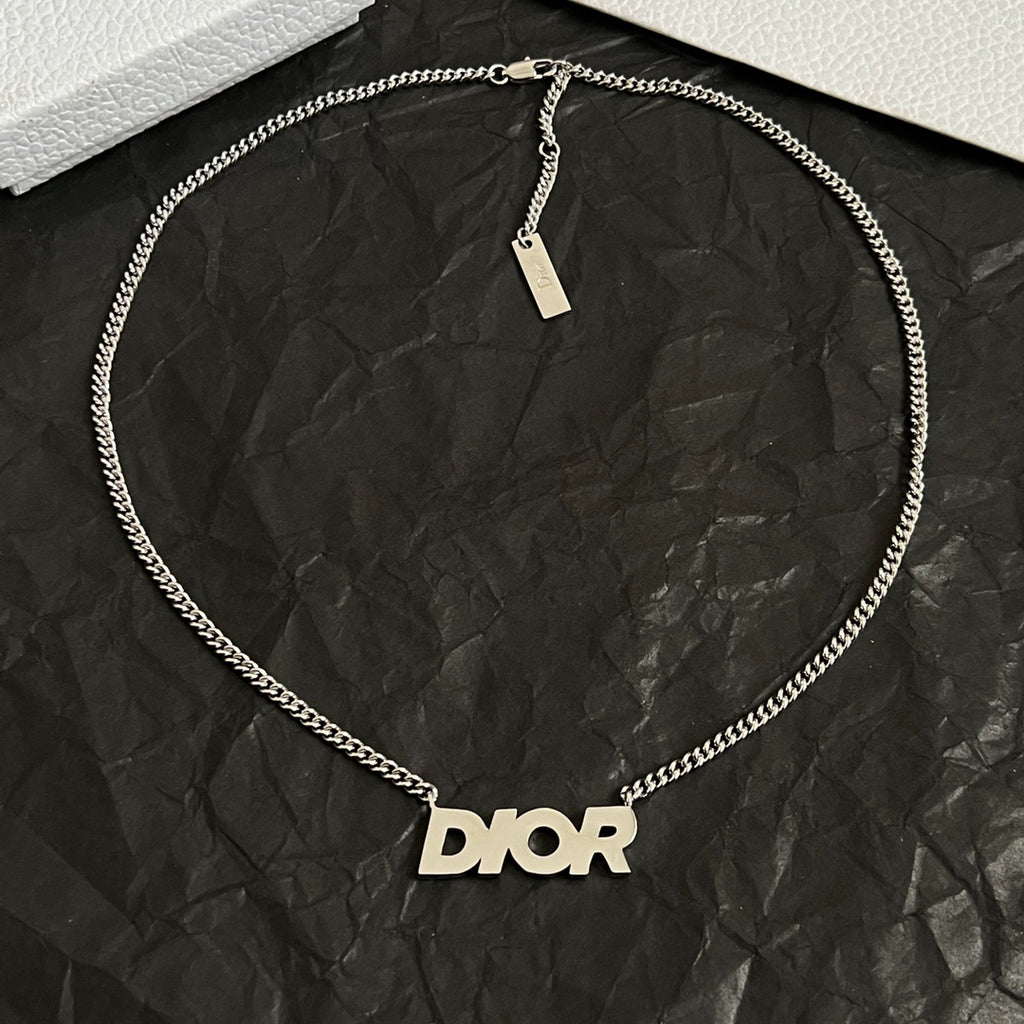 Dior necklace with silver chain and Dior logo pendant on round loop