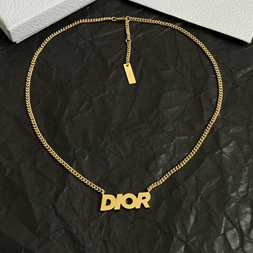 Gold-tone Dior necklace with Dior pendant and rectangular ID tag.