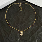 Dior gold-tone collar necklace with heart drop pendant and short link chain