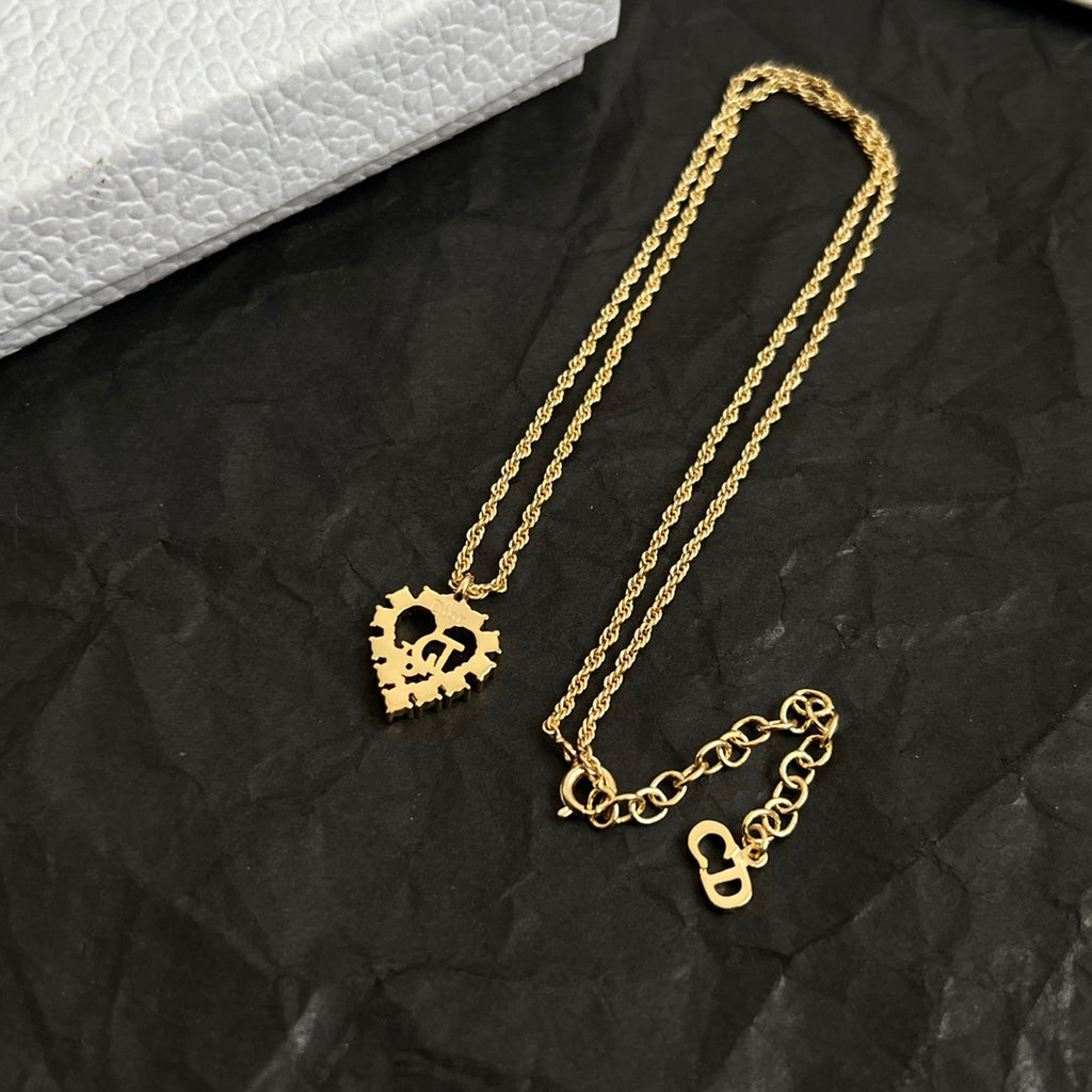 Dior gold-tone layered necklaces set with heart pendants and chain links