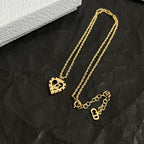 Dior gold-tone layered necklaces set with heart pendants and chain links