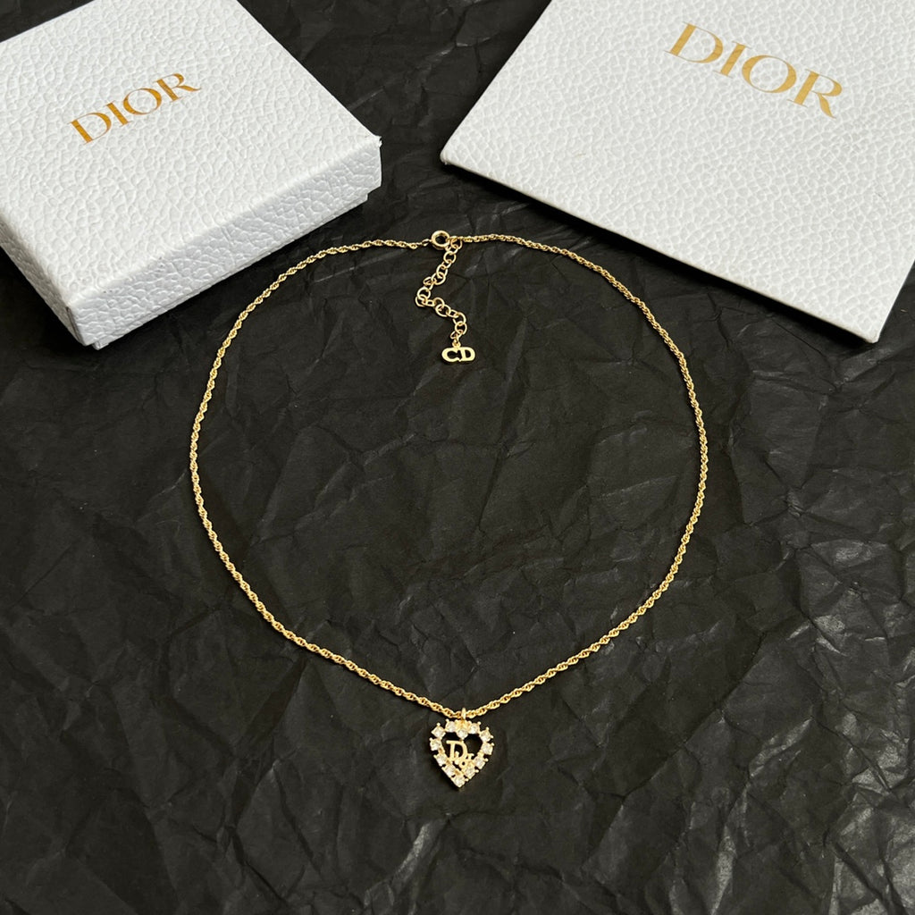 Dior gold-tone collar necklace with heart pendant and small logo charm