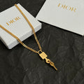 Dior gold-tone key charm necklace with link chain and D-style padlock tag