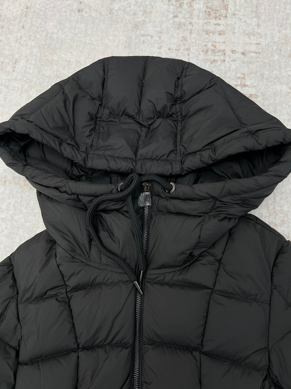 Dark puffer coat hood with adjustable drawcord and front zipper