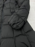 Dark puffer coat sleeve cuff and quilted padding detail