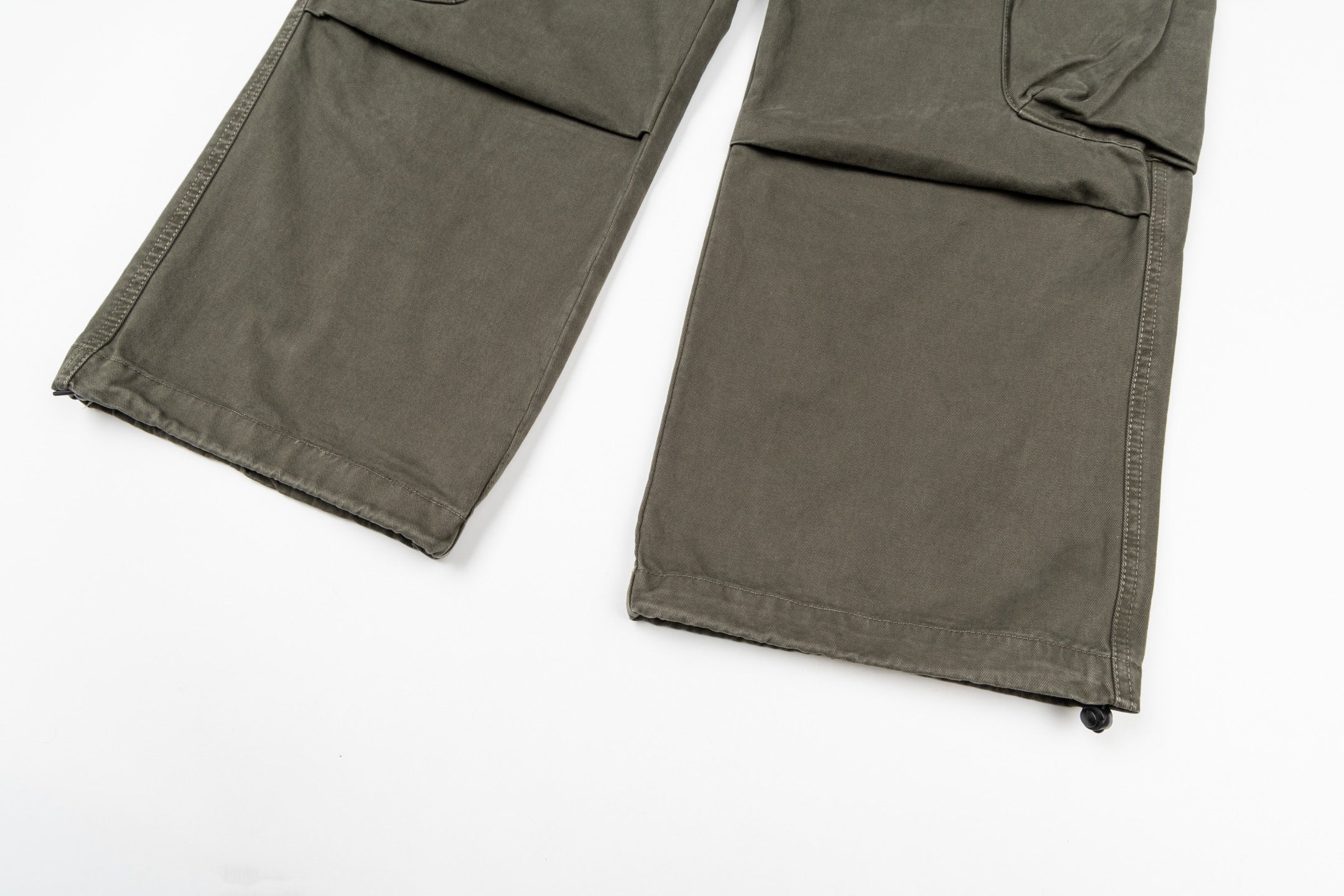 Stone Island olive cargo pants with flap cargo pockets and wide cuff hems