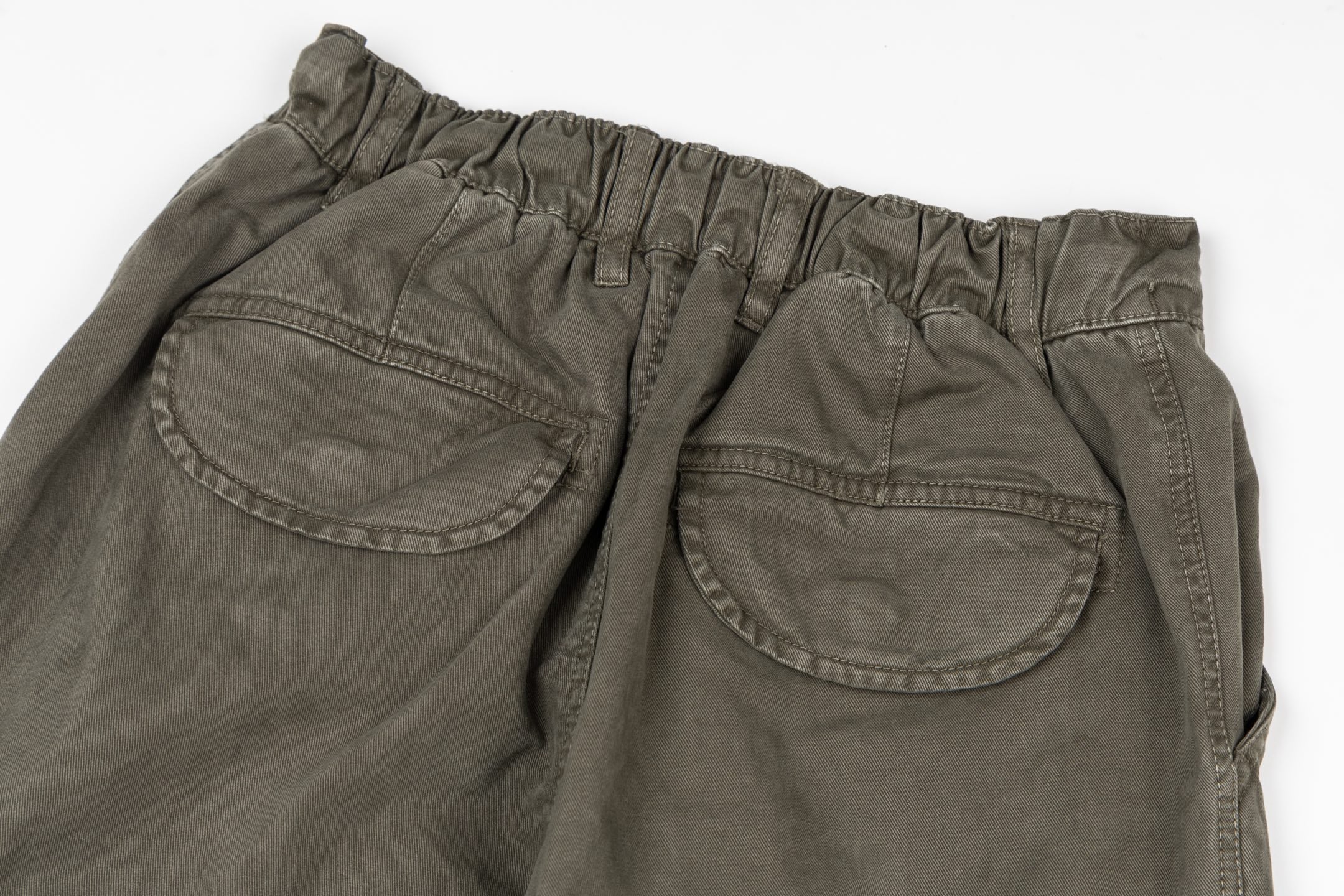 Stone Island olive cargo pants back view with welt pockets and elastic waistband