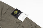 Stone Island olive cargo pants with black label patch on a front pocket