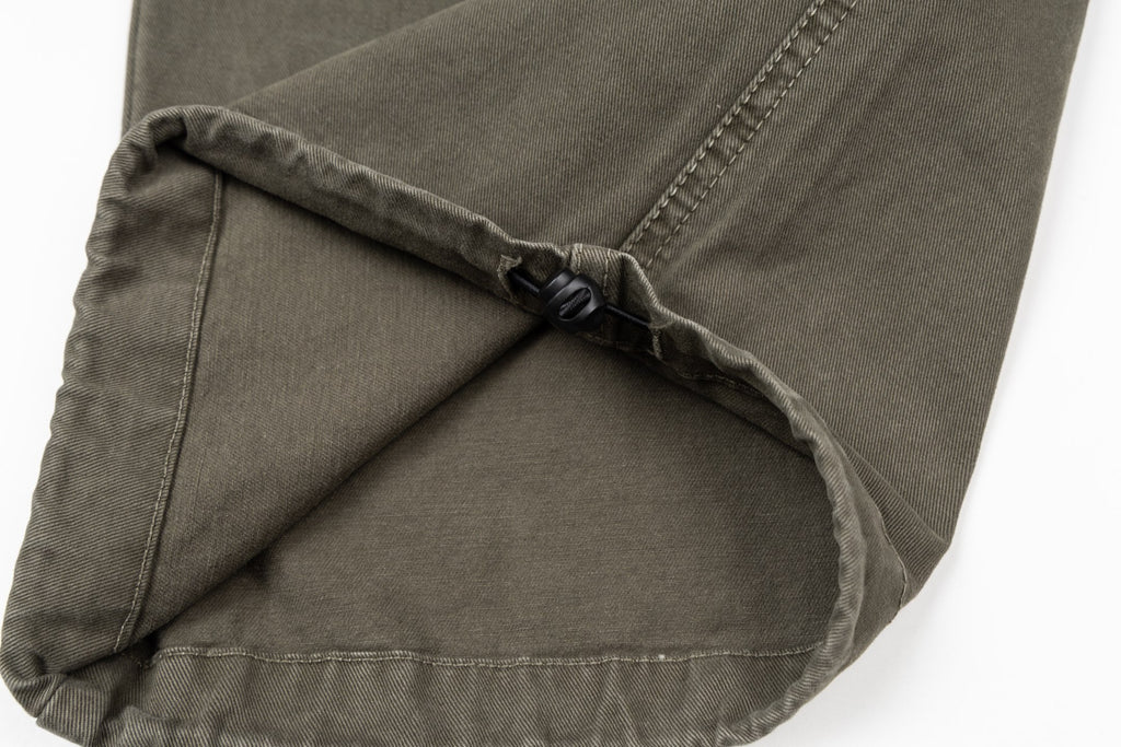 Stone Island olive cargo pants close-up of inner drawcord and pocket seam