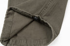 Stone Island olive cargo pants close-up of inner drawcord and pocket seam