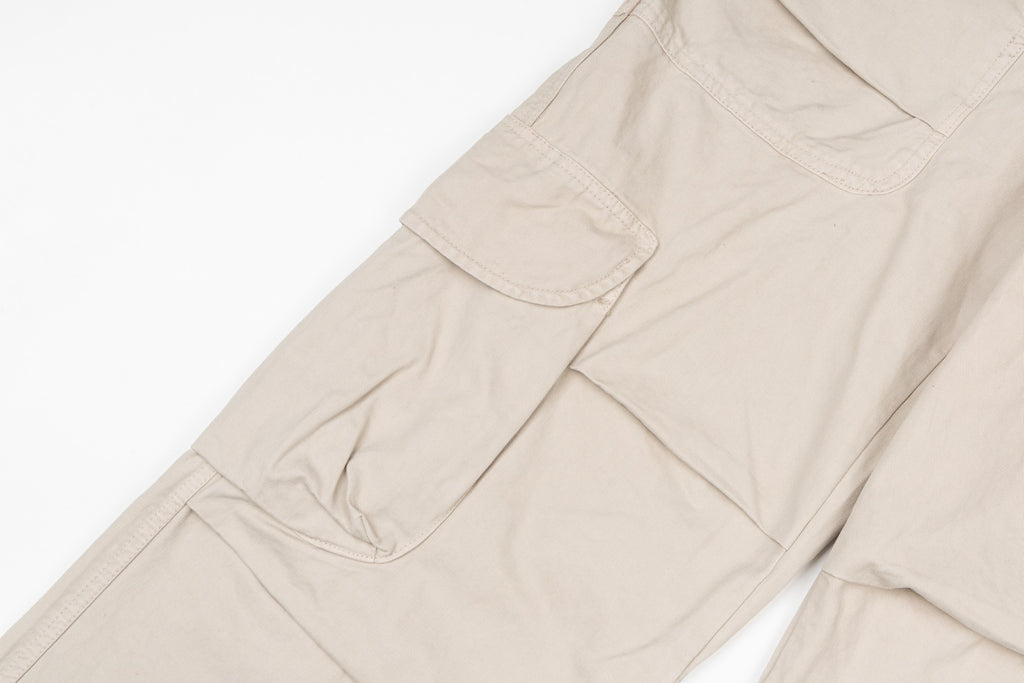 Stone Island beige cargo pants with stitched pocket panels and seams