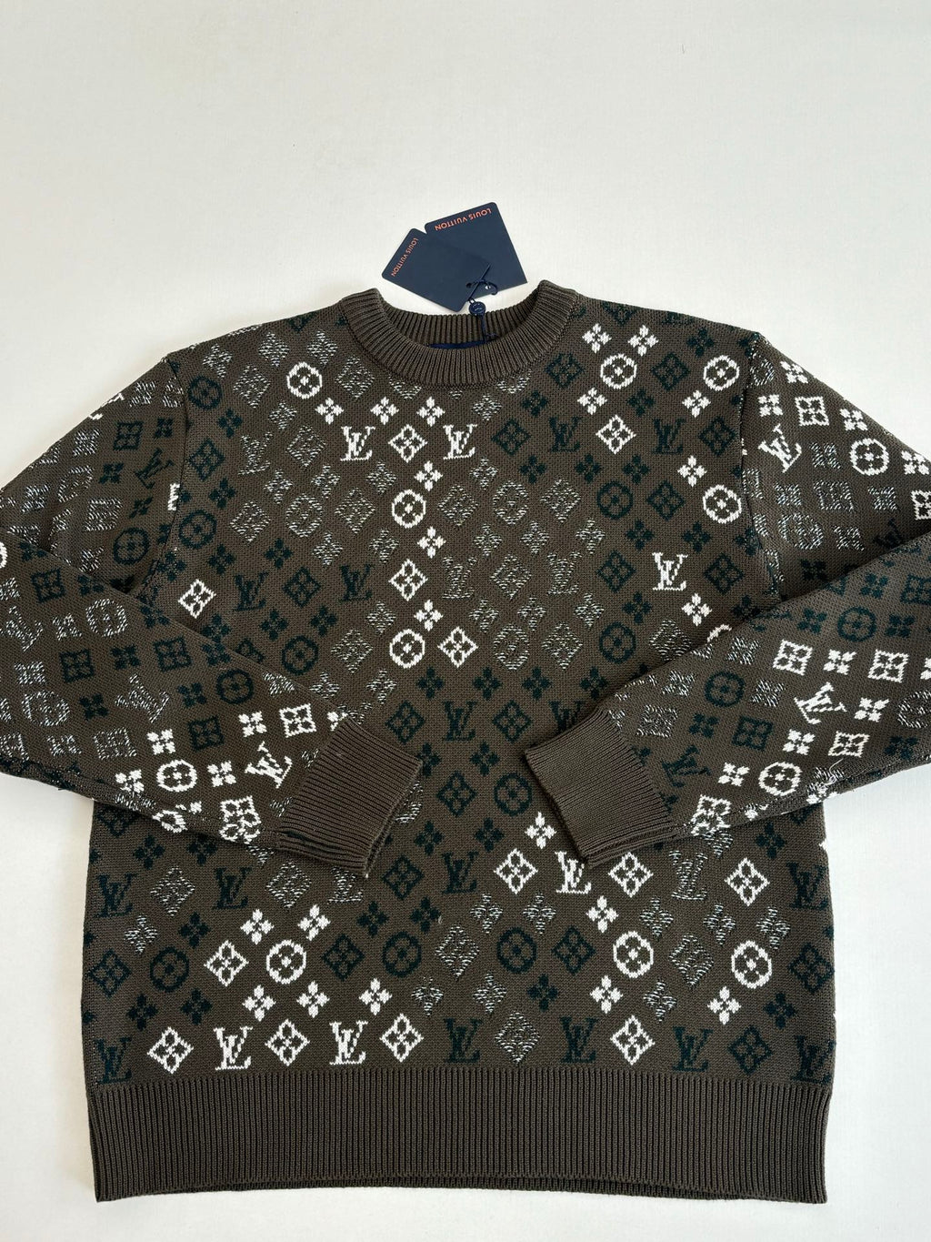 Crewneck knit sweater with dark allover logo-style pattern and ribbed neckline