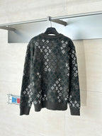Crewneck knit sweater in dark tone with allover pattern, ribbed cuffs