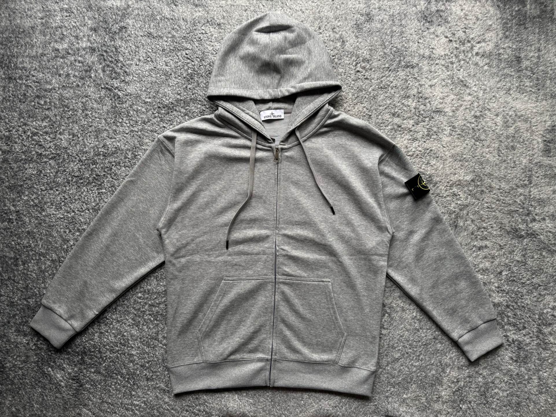 Gray zip-up hoodie with drawstring hood and front kangaroo pocket