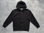 Black zip-up hoodie with drawstring hood and front kangaroo pocket