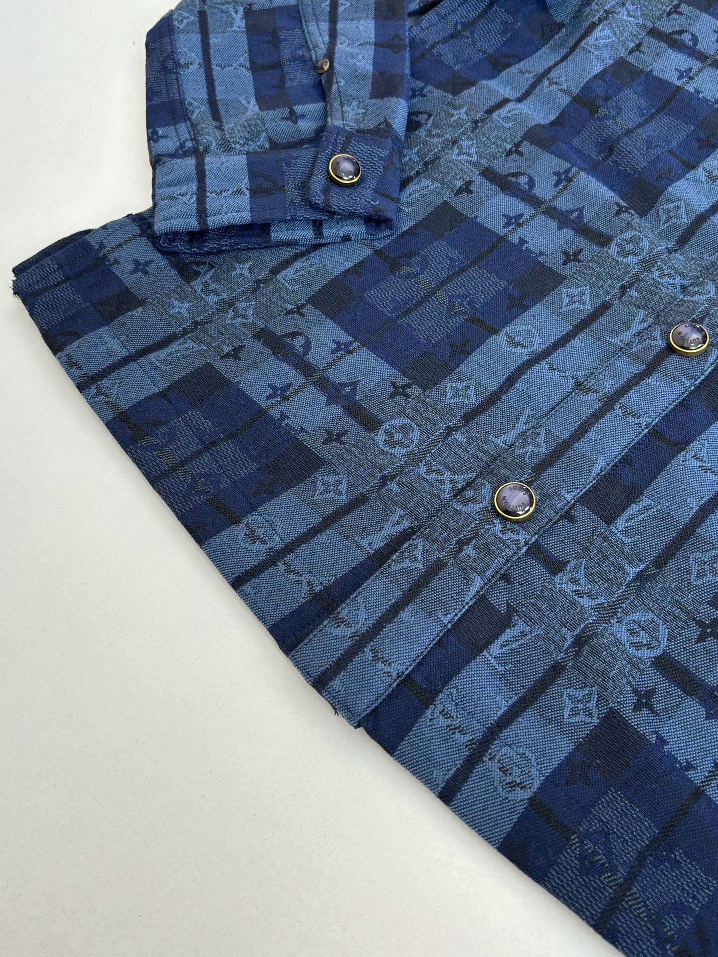 Louis Vuitton blue plaid trousers with buttoned fly and front flap pockets