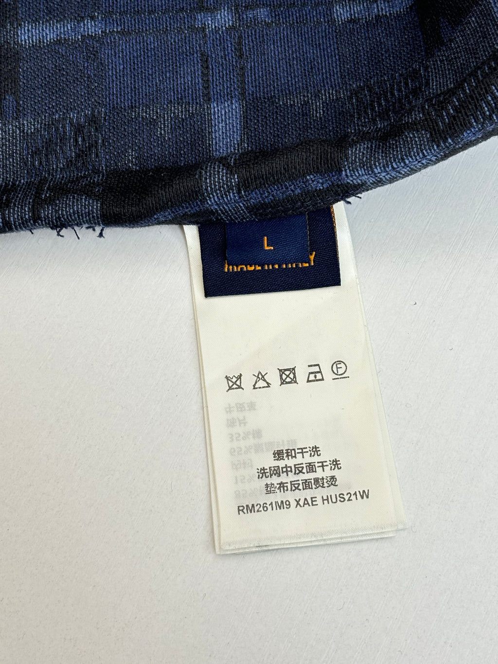 Louis Vuitton long-sleeve shirt care label with washing symbols and style code