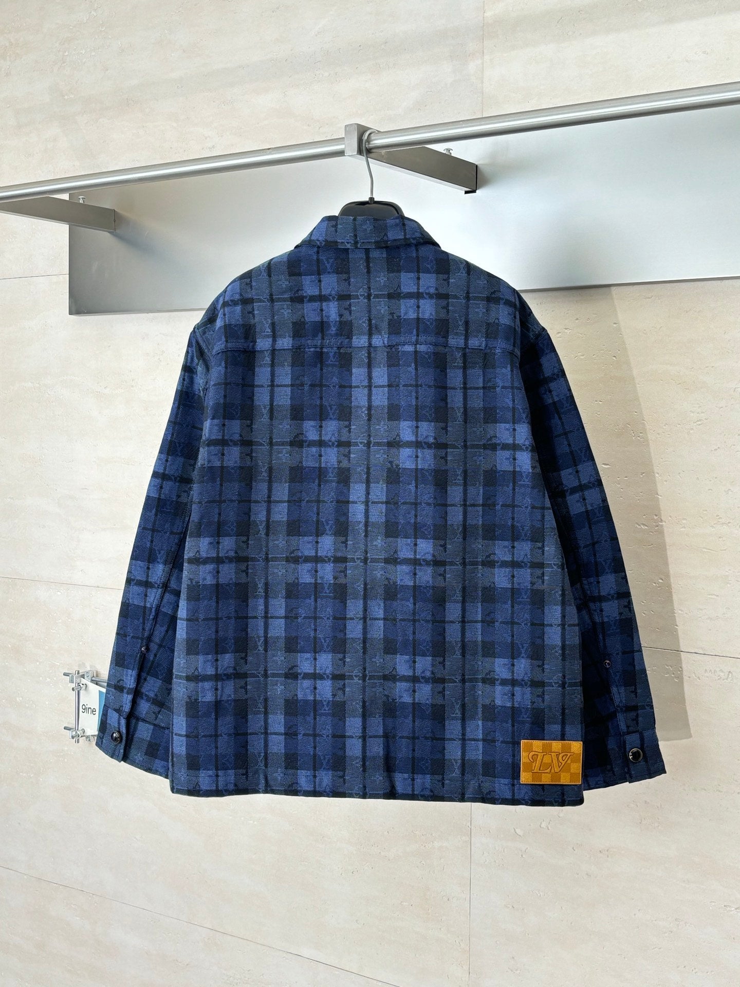 Louis Vuitton blue plaid long-sleeve jacket back view with buttoned cuffs