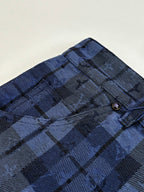 Dark blue plaid fabric with stitched waistband and belt loops detail