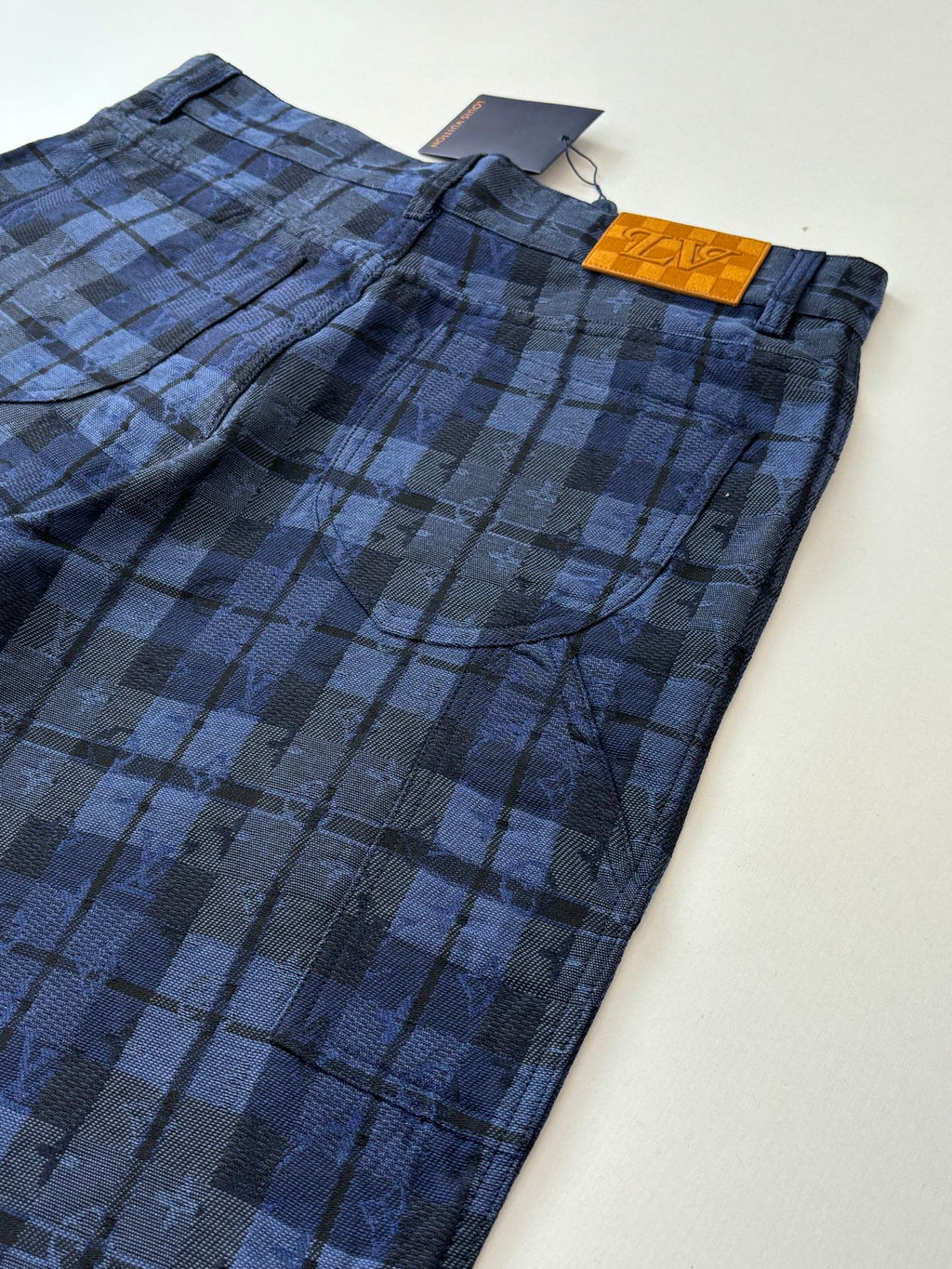 Blue plaid pants with waistband and front button, Louis Vuitton tag
