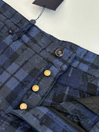 Checked trousers waistband detail, metal buttons and belt loops