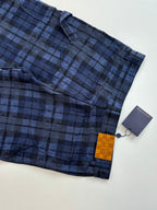 Plaid trousers hem and pocket area in dark blue check with hang tag